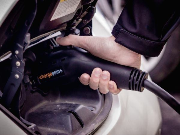 Electric car charging station charging a Nissan Leaf